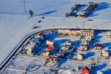 Aerial view of New development area An Höhenweg in snow in winter in Kandel in the state Rhineland-Palatinate, Germany