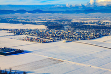Village view from the southeast in snow in winter in Steinweiler in the state Rhineland-Palatinate, Germany