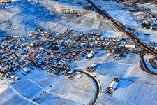 Aerial photograpy of Wine-growing village under the Keschdebusch vineyard in winter with snow in Birkweiler in the state Rhineland-Palatinate, Germany