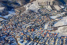 View of the town from the south in snow in winter in Albersweiler in the state Rhineland-Palatinate, Germany