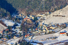 Schlossstraße in winter with snow in Albersweiler in the state Rhineland-Palatinate, Germany
