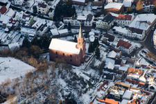Winterly Town View of the streets and houses of the residential areas in Albersweiler in the state Rhineland-Palatinate from above