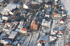 Winterly Town View of the streets and houses of the residential areas in Albersweiler in the state Rhineland-Palatinate seen from above