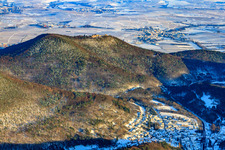 Village view below the Madenburg in the Palatinate Forest in snow in winter in Waldhambach in the state Rhineland-Palatinate, Germany