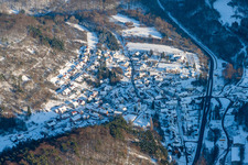 Winter snow-covered village view in Waldhambach in the state Rhineland-Palatinate, Germany