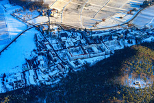 Castle ruins Waldschlössel above the Pfalzklinikum Landeck in winter with snow in Klingenmünster in the state Rhineland-Palatinate, Germany