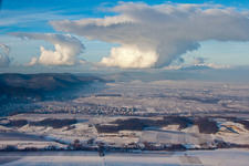 Wintry snowy townscape with streets and houses of the residential areas in Klingenmuenster in the state Rhineland-Palatinate