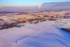 Village view in snow in winter from the southwest in Dierbach in the state Rhineland-Palatinate, Germany