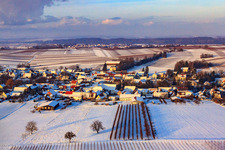 Village view in snow in winter from the south in Dierbach in the state Rhineland-Palatinate, Germany