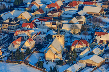 Catholic Church Minfeld in the evening light with snow in winter in Minfeld in the state Rhineland-Palatinate, Germany