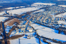 Aerial photograpy of Village view in snow in winter from the west in Neuburg am Rhein in the state Rhineland-Palatinate, Germany