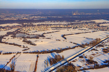 Village view in snow in winter from the southeast in Neuburg am Rhein in the state Rhineland-Palatinate, Germany