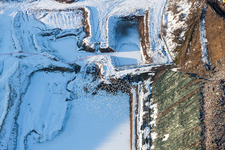 Aerial view of Wintry snowy Site of heaped landfill in Schaffhouse-pres-Seltz in Grand Est, France