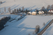 Football club with its own chapel in winter when there is snow in Neewiller-près-Lauterbourg in the state Bas-Rhin, France
