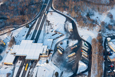 Wintry snowy Lorries and Truck storage areas and free-standing storage on former customs Lauterbourg now state-police department Bienwald in Scheibenhard in Grand Est, France