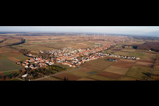 Panoramic perspective Village - view on the edge of agricultural fields and farmland in Freckenfeld in the state Rhineland-Palatinate, Germany