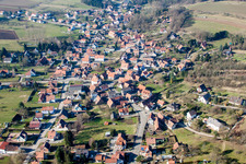 Aerial view of Village - view on the edge of agricultural fields and farmland in Lobsann in Grand Est, France