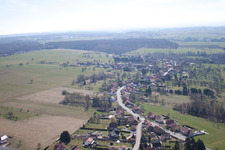 Aerial view of Village - view on the edge of agricultural fields and farmland in Struth in Grand Est, France