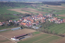 Village - view on the edge of agricultural fields and farmland in Geiswiller in Grand Est, France