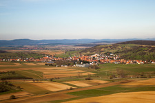 Village - view on the edge of agricultural fields and farmland in Kirrwiller in Grand Est, France