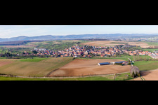 Aerial view of Panoramic perspective Village - view on the edge of agricultural fields and farmland in Mietesheim in Grand Est, France