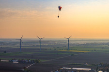 Paraglider over the wind farm Minfeld in Minfeld in the state Rhineland-Palatinate, Germany