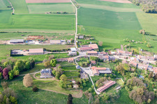 Village - view on the edge of agricultural fields and farmland in Fresnois in Grand Est, France