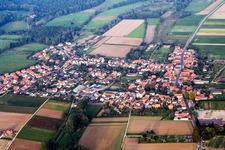 Aerial view of Village - view on the edge of agricultural fields and farmland in Knittelsheim in the state Rhineland-Palatinate