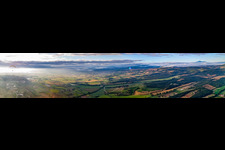 Panorama of sunrise over the landscape with paraglider pilots in Sinalunga in the state Siena, Italy