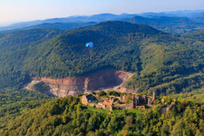 Oblique view of Paraglider over the Madenburg in Eschbach in the state Rhineland-Palatinate, Germany