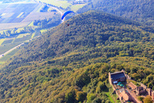 Paraglider over the Madenburg in Eschbach in the state Rhineland-Palatinate, Germany out of the air