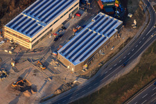 Oblique view of Maximiliancenter II with construction site for dm and Sport Fink in the district Maximiliansau in Wörth am Rhein in the state Rhineland-Palatinate, Germany