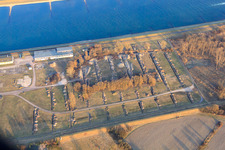 Storage areas for Daimler trucks on the banks of the Rhine in the district Maximiliansau in Wörth am Rhein in the state Rhineland-Palatinate, Germany