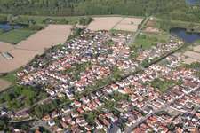 Aerial view of Village - view on the edge of agricultural fields and farmland in Leimersheim in the state Rhineland-Palatinate