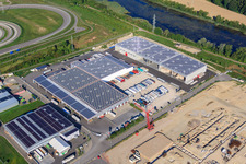 Aerial view of Halls and trucks of the NUSS Group in the Oberwald industrial area in Wörth am Rhein in the state Rhineland-Palatinate, Germany