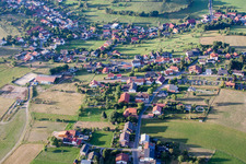 Oblique view of Village - view on the edge of agricultural fields and farmland in Wuerzberg in the state Hesse, Germany