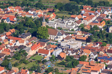 Aerial view of Municipal administration, Church of St. Mauritius and Braunsche Foundation in Rülzheim in the state Rhineland-Palatinate, Germany