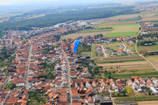 Paraglider over Luitpoldstrasse in Hatzenbühl in the state Rhineland-Palatinate, Germany