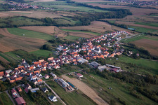 Aerial view of Village - view on the edge of agricultural fields and farmland in Forstheim in Grand Est, France