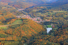 Village view in the Palatinate Forest behind Lake Silz from the west in Silz in the state Rhineland-Palatinate, Germany