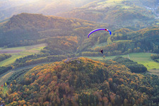 Paraglider over the castle ruins of Lindelbrunn in Vorderweidenthal in the state Rhineland-Palatinate, Germany