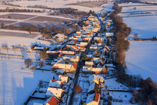 Aerial view of Village view from the west in winter with snow in Vollmersweiler in the state Rhineland-Palatinate, Germany