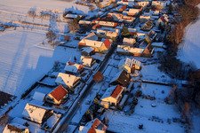 Aerial photograpy of Village view from the west in winter with snow in Vollmersweiler in the state Rhineland-Palatinate, Germany