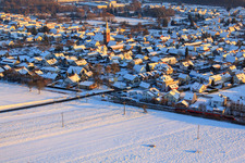 Volmersweilerer Straße in winter with snow in the district Schaidt in Wörth am Rhein in the state Rhineland-Palatinate, Germany