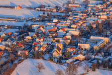 Catholic church in winter with snow in Minfeld in the state Rhineland-Palatinate, Germany