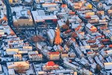 Primary school, town hall and St. George's Church on the market square in winter with snow in Kandel in the state Rhineland-Palatinate, Germany