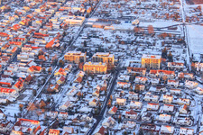 Apartment blocks in Raiffeisenstraße in winter with snow in Kandel in the state Rhineland-Palatinate, Germany