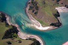 Water surface at the seaside between twi islands in the Mcgregor Bay in Wyuna Bay in Waikato, New Zealand