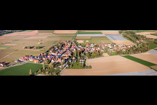 Aerial view of Panoramic perspective Village - view on the edge of agricultural fields and farmland in Kleinfischlingen in the state Rhineland-Palatinate, Germany