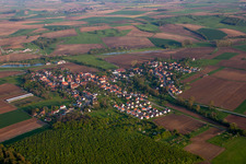 Aerial view of Village - view on the edge of agricultural fields and farmland in Kutzenhausen in Grand Est, France